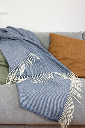 A throw, in blue. Sweatershop.com