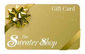 Gold gift card with a bow from 'The Sweater Shop' on a white background
