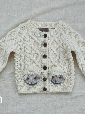 handknit_cardigan_with_sheep_83588d7e-5a2a-492a-a74c-1d11ff5c77f9.jpg
